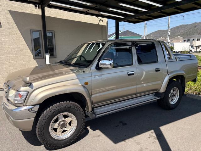 2003 Toyota Hilux Sports Pickup Double Cab (RZN169H) — Gold - Image 1